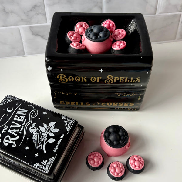 pink and black cauldron wax melts