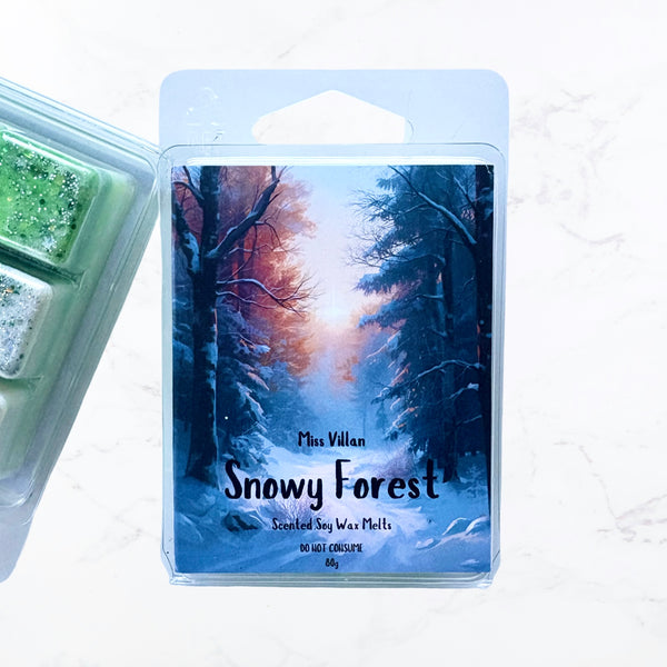 Scented wax melts packaging with 'Snowy Forest' design on a white background